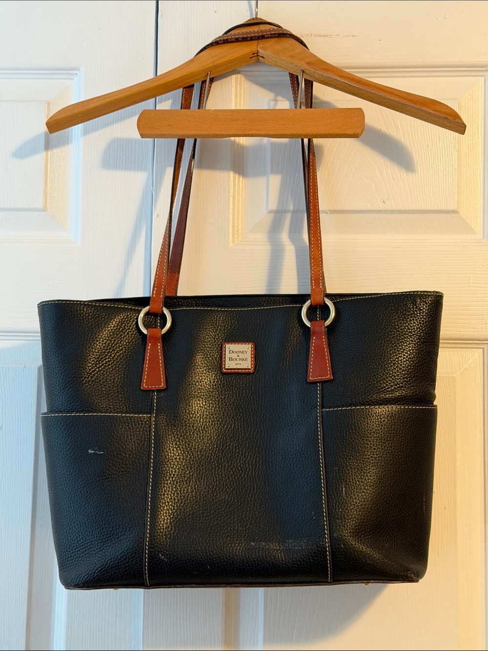 Dooney & Bourke Black Pebbled Tote with Brown Straps and Exterior Pockets